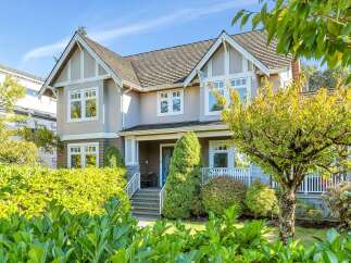 This stunning property boasts a beautiful exterior with a well-maintained yard and lush landscaping.