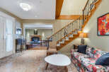 Step into luxury with this stunning property, featuring a grand staircase and elegant design.