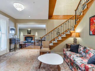 Step into luxury with this stunning property, featuring a grand staircase and elegant design.