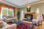 This elegant living room boasts a cozy fireplace, perfect for chilly evenings.