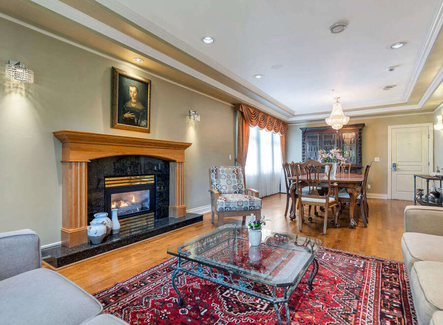 Step into luxury with this stunning property, featuring a cozy fireplace perfect for chilly evenings.