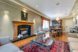 Step into luxury with this stunning property, featuring a cozy fireplace perfect for chilly evenings.