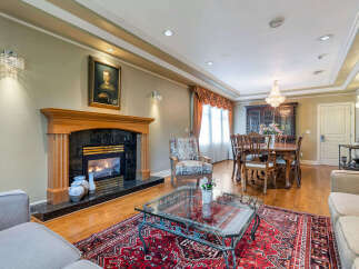 Step into luxury with this stunning property, featuring a cozy fireplace perfect for chilly evenings.