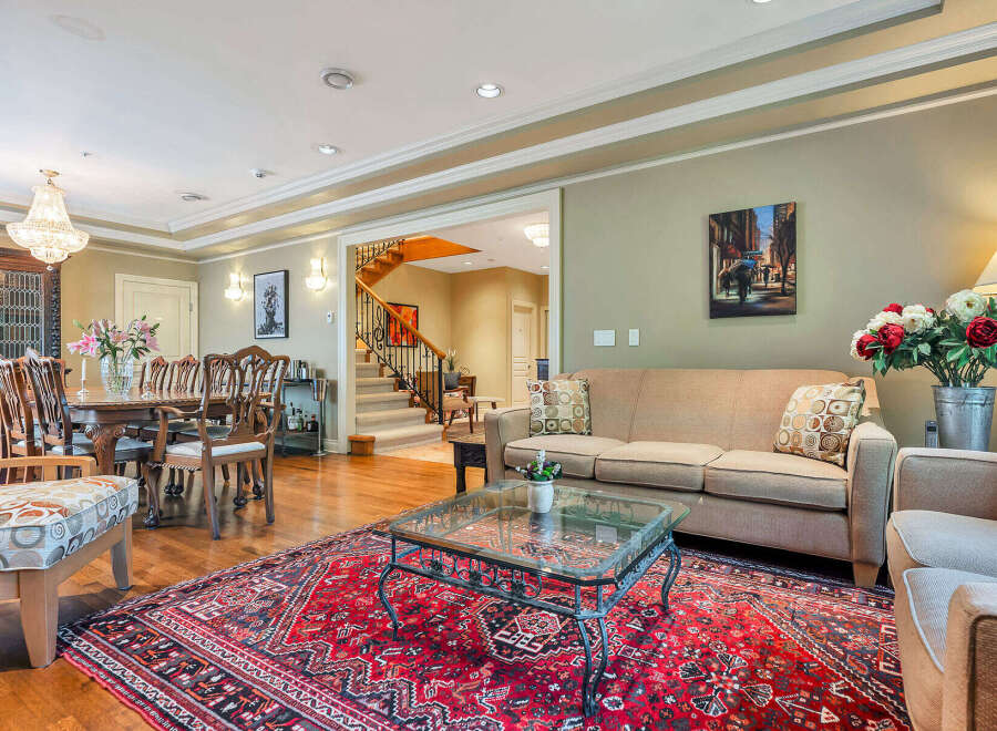 Step into luxury with this stunning property, showcasing a spacious living area perfect for entertaining.