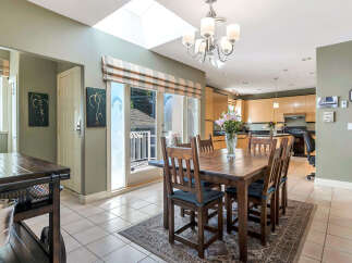 Step into this inviting dining space, perfect for both intimate meals and entertaining.