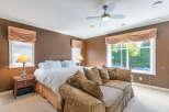 Step into luxury with this stunning bedroom! Featuring a comfortable bed, a stylish sofa, and elegant window treatments, this space is designed for relaxation.