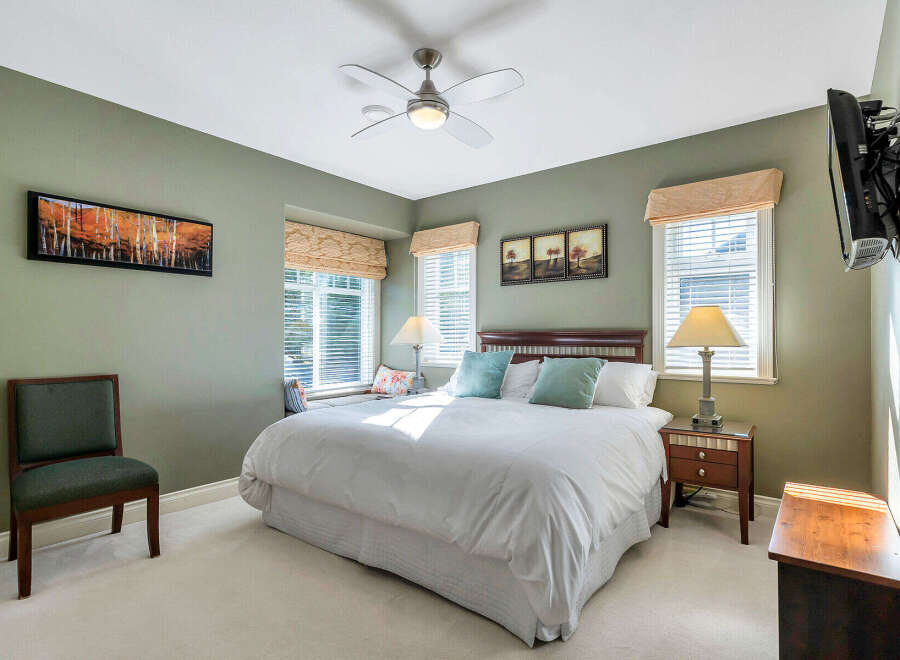This inviting bedroom boasts a serene ambiance, perfect for relaxation.
