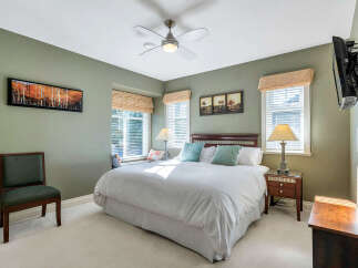 This inviting bedroom boasts a serene ambiance, perfect for relaxation.