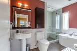 Step into luxury with this stunning bathroom featuring a modern design and high-end finishes.