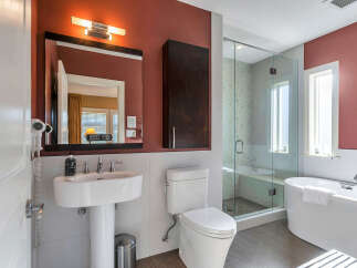 Step into luxury with this stunning bathroom featuring a modern design and high-end finishes.