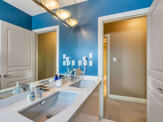 Step into luxury with this stunning bathroom featuring a sleek double vanity and a modern design.