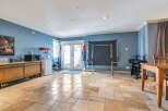 This spacious property boasts a versatile interior, perfect for entertaining or relaxation.