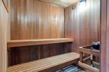 Step into your own private oasis with this stunning sauna! Featuring beautiful wood paneling and two-tiered seating, this space is perfect for relaxation and rejuvenation.