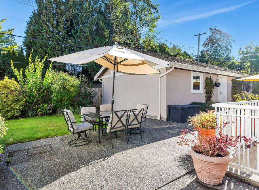 Enjoy outdoor living at its finest with this charming patio space.