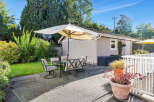 Enjoy outdoor living at its finest with this charming patio space.