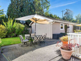 Enjoy outdoor living at its finest with this charming patio space.