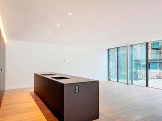 This modern kitchen boasts sleek design and ample space, perfect for culinary enthusiasts.