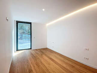 This modern space boasts a sleek design with clean lines and abundant natural light.