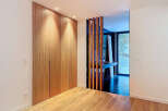 This stunning property boasts a modern design with sleek wooden accents and ample natural light.