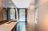 Experience luxury in this modern bathroom featuring stunning marble accents and a sleek, minimalist design.