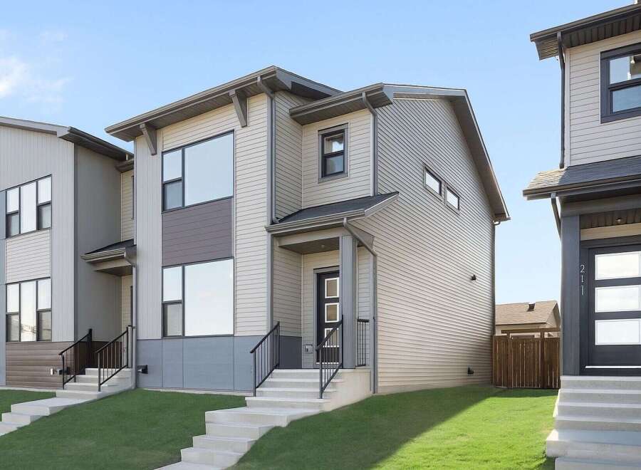 This stunning modern home boasts a sleek design with clean lines and contemporary finishes.