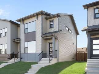 This stunning modern home boasts a sleek design with clean lines and contemporary finishes.