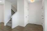 Step into this beautifully designed home featuring a modern staircase and a welcoming entryway.