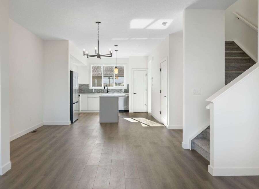 Step into modern elegance with this stunning property, featuring a bright and airy open-concept living space.