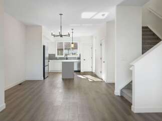 Step into modern elegance with this stunning property, featuring a bright and airy open-concept living space.