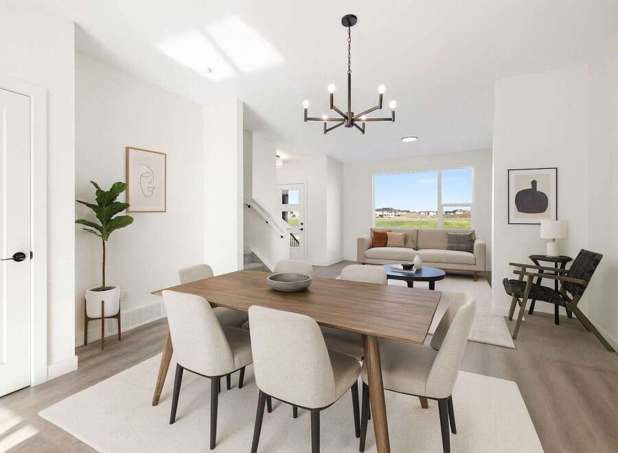 Step into modern elegance with this stunning property, showcasing a bright and airy dining area.