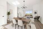 Step into modern elegance with this stunning property, showcasing a bright and airy dining area.