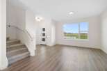 Step into this stunning home featuring a bright and airy living space with beautiful hardwood floors.