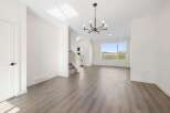 Step into this stunning home featuring a bright and airy living space with beautiful hardwood floors.