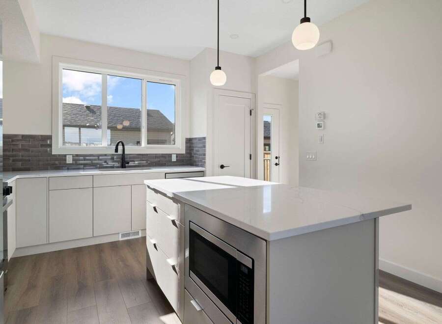 This stunning kitchen boasts modern design and functionality.