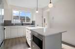This stunning kitchen boasts modern design and functionality.