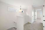 This stunning property features a bright and airy hallway with modern finishes.