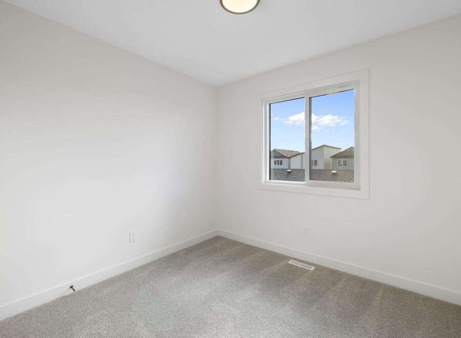 Discover the potential of this bright and airy room, perfect for a bedroom or home office.