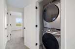Discover the convenience of modern living with this stunning property! Featuring a dedicated laundry area with a sleek, stacked washer and dryer, making chores a breeze.
