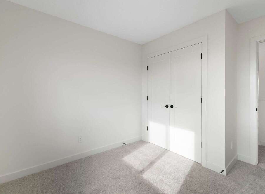 This bright and airy room features a neutral color palette, perfect for creating a calming atmosphere.