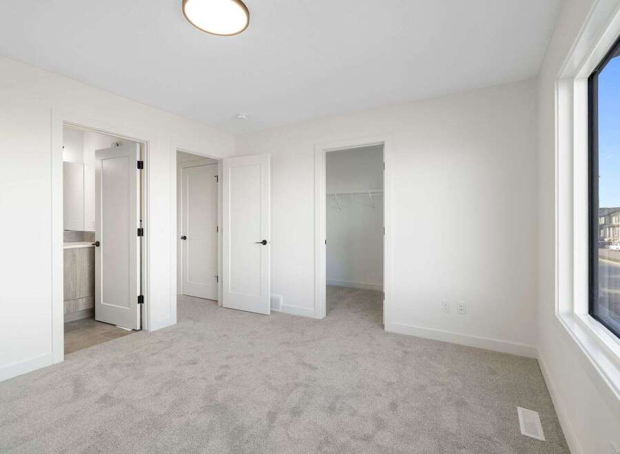 Step into this bright and airy bedroom, featuring neutral tones and ample natural light.