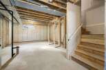This unfinished basement offers a blank canvas for your dream living space.