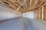This spacious garage offers ample room for vehicles and storage.