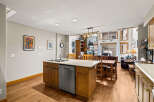 This stunning kitchen boasts a modern design with a spacious island, perfect for meal preparation and entertaining.