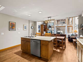 This stunning kitchen boasts a modern design with a spacious island, perfect for meal preparation and entertaining.