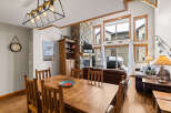This stunning property boasts a cozy living space with a stone fireplace, perfect for those chilly evenings.