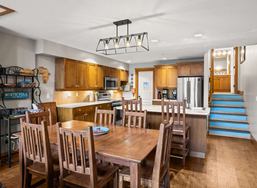 This stunning kitchen and dining area is the heart of the home, featuring beautiful wooden cabinetry and a spacious layout.