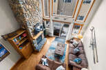 This stunning living room features a cozy stone fireplace, perfect for those chilly evenings.