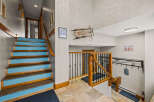This stunning property boasts a welcoming entryway with a unique staircase design, perfect for making a grand first impression.