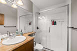 Step into this beautifully designed bathroom featuring a modern glass shower and a stylish vanity.