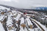 Nestled in a winter wonderland, this property offers stunning views and cozy living.